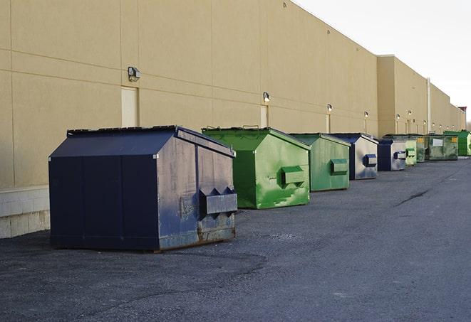 a group of dumpsters lined up along the street ready for use in a large-scale construction project in Hillside, NJ